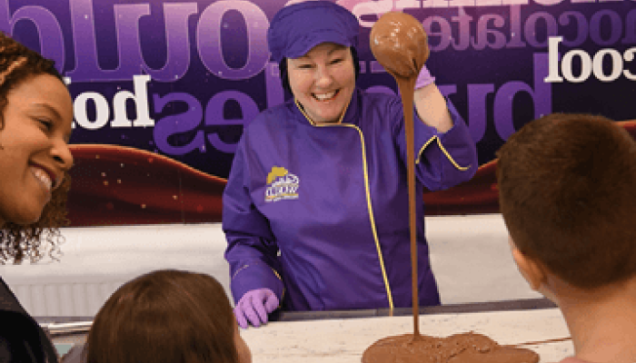 Cadbury world chocolatier handling chocolate to spectators 