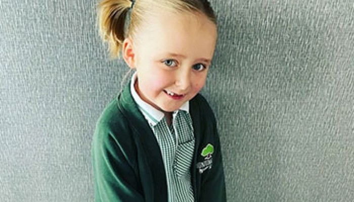 Little girl in school uniform