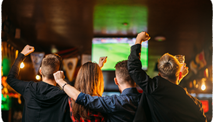 People watching football in pub