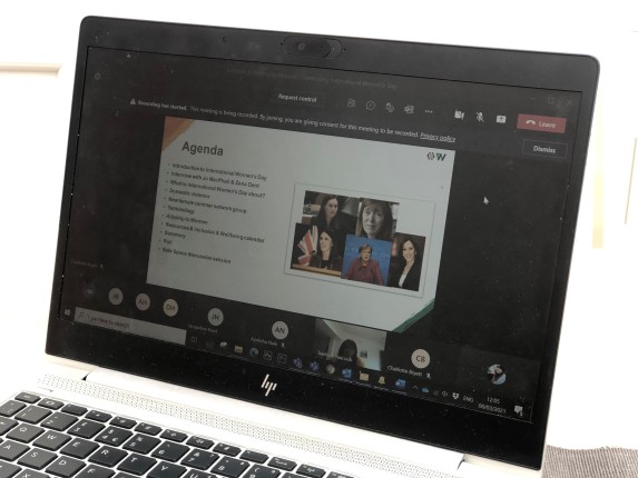 laptop showing a presentation of International Women's Day webinar.